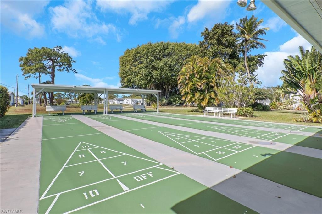 View of property's community with shuffleboard
