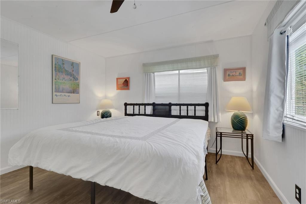 Bedroom featuring wood finished floors and ceiling fan