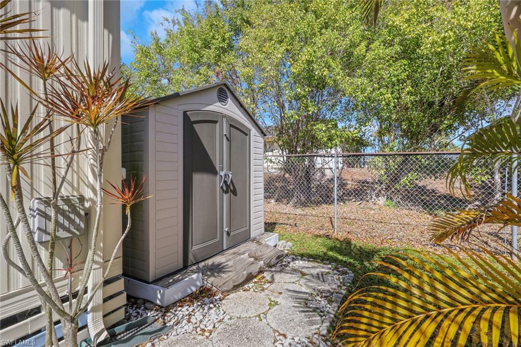 View of shed featuring a fenced backyard