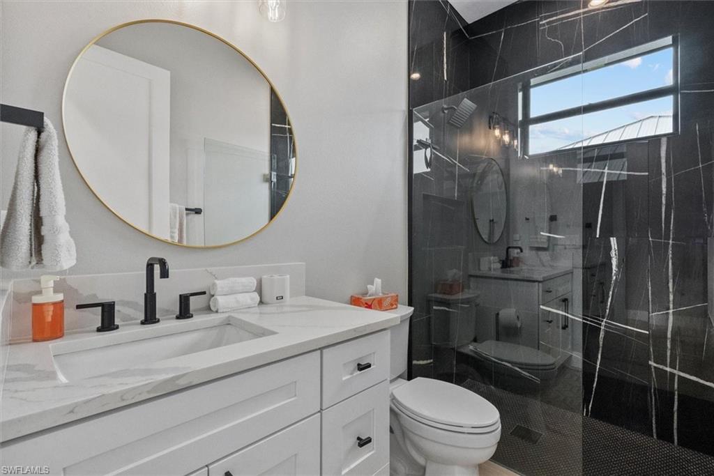 Bathroom with vanity and a tile finish shower
