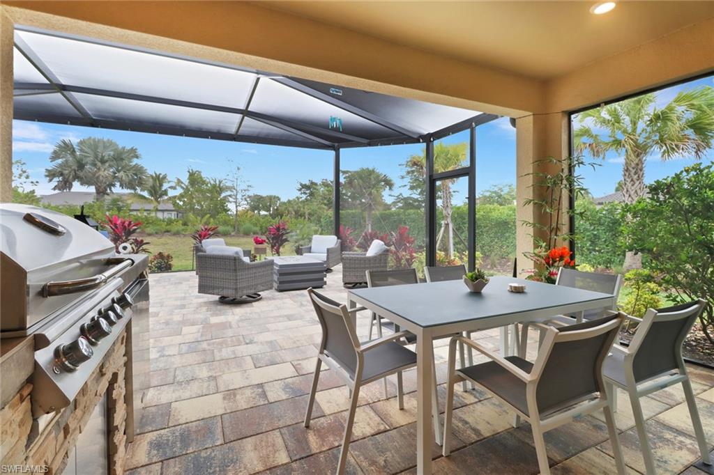 View of patio featuring outdoor lounge area and a grill