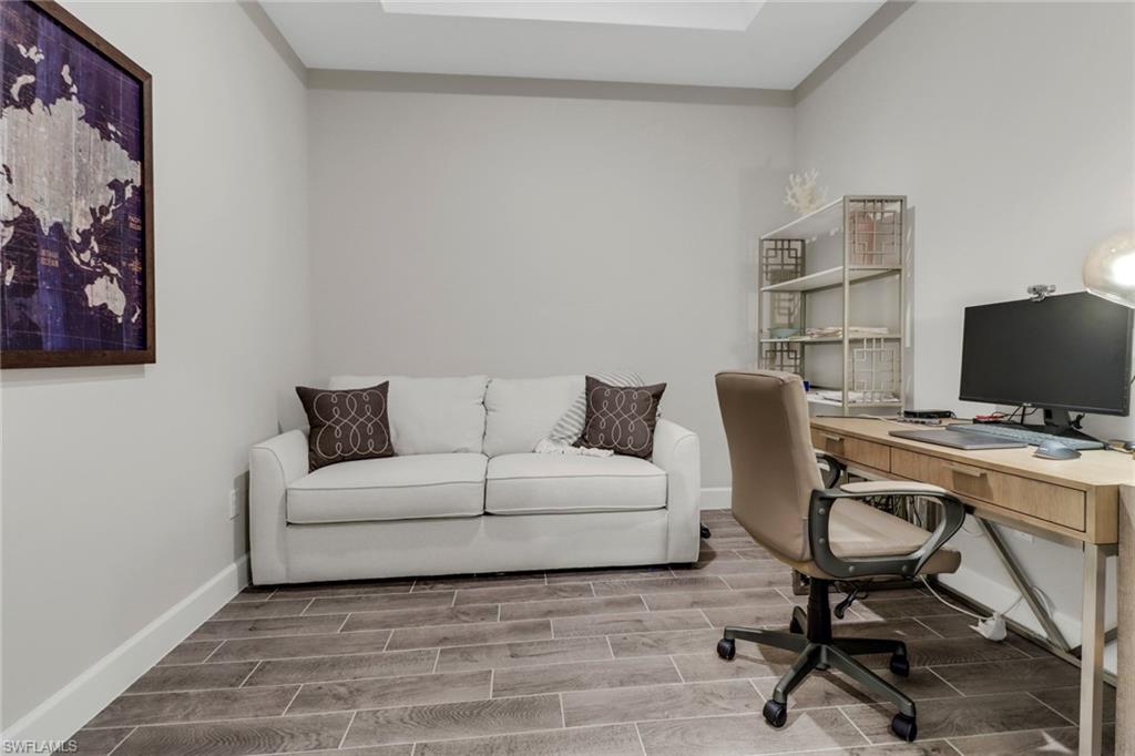 Home office with wood tiled floors and baseboards