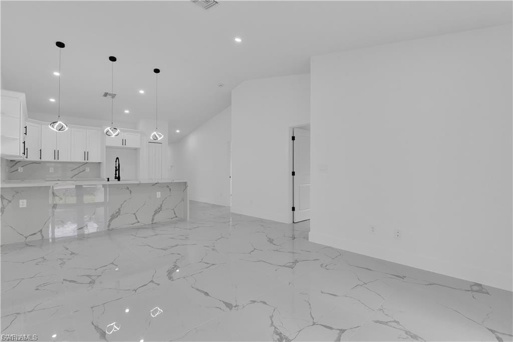 Unfurnished living room with recessed lighting