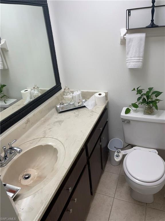 Bathroom with vanity and light tile patterned flooring