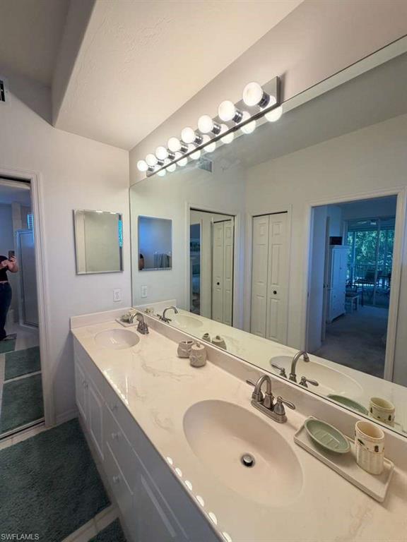 Full bathroom featuring double vanity