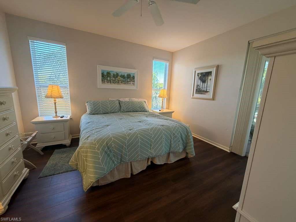 Bedroom featuring dark wood-style flooring and a ceiling fan