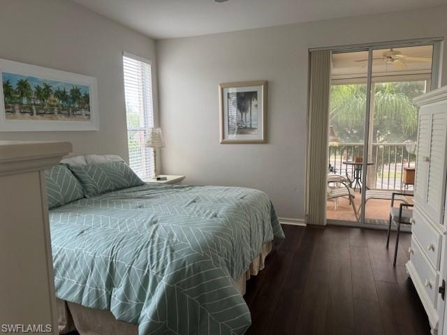 Bedroom featuring access to exterior and dark wood-type flooring