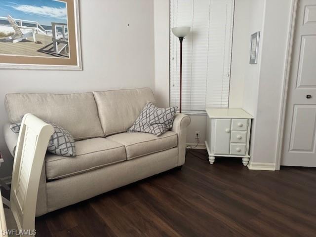 Living area featuring wood finished floors and baseboards