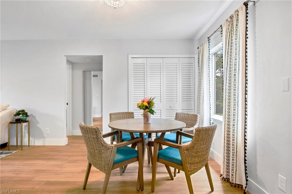 Dining space featuring light wood-type flooring and baseboards