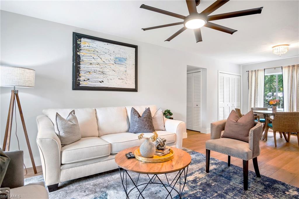 Living room featuring wood finished floors and ceiling fan