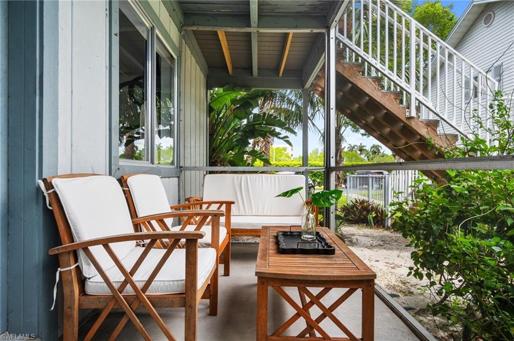 View of patio / terrace featuring outdoor lounge area and stairs