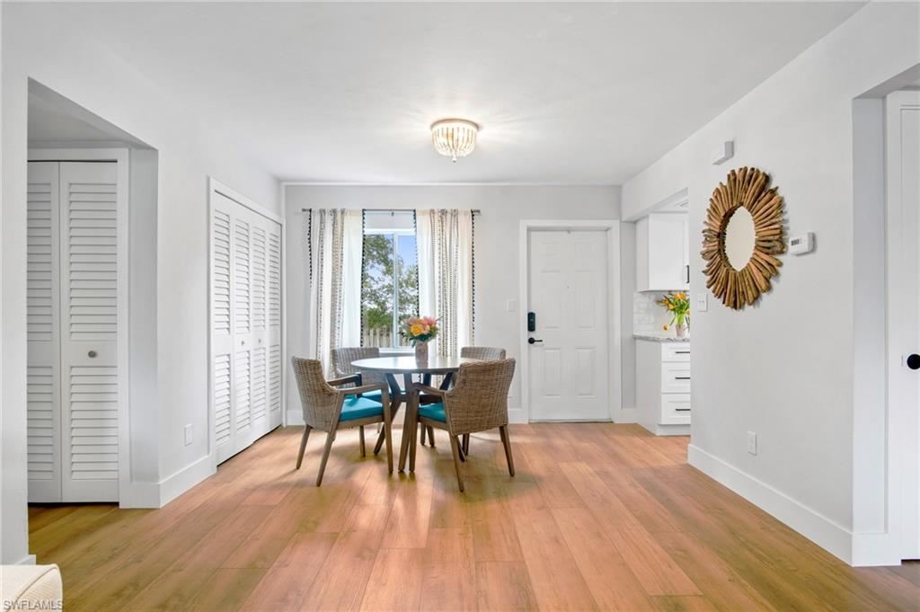 Dining area featuring light wood-type flooring and baseboards