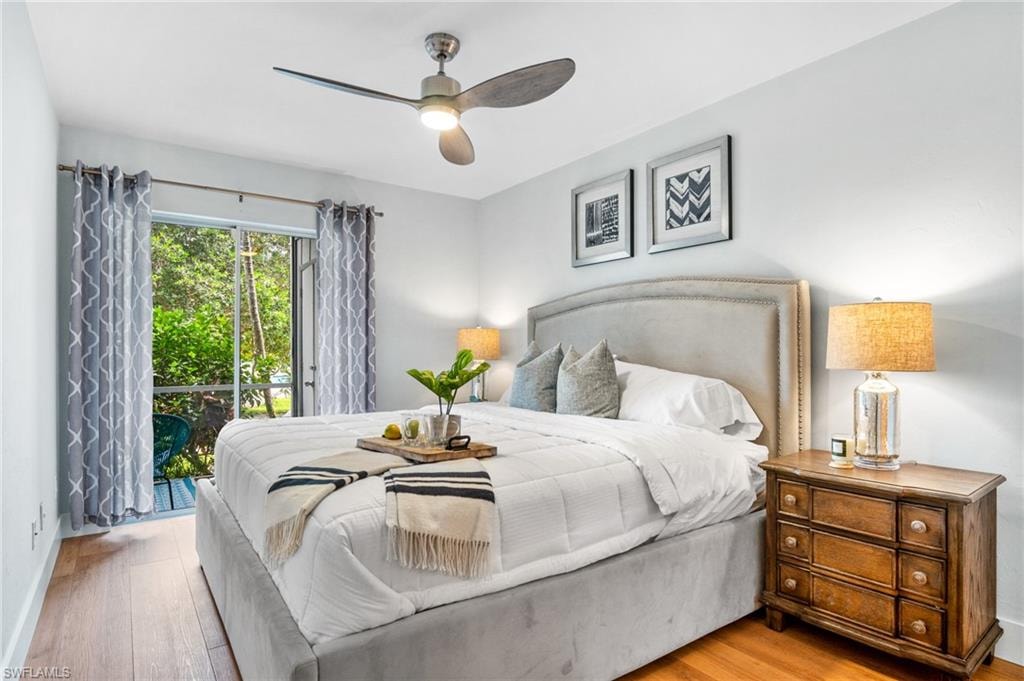 Bedroom with access to exterior, light wood-style flooring, and ceiling fan