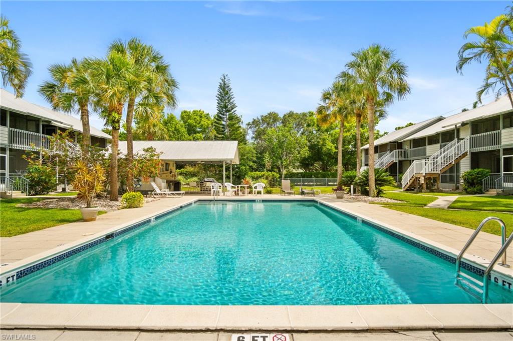 Community pool with a patio