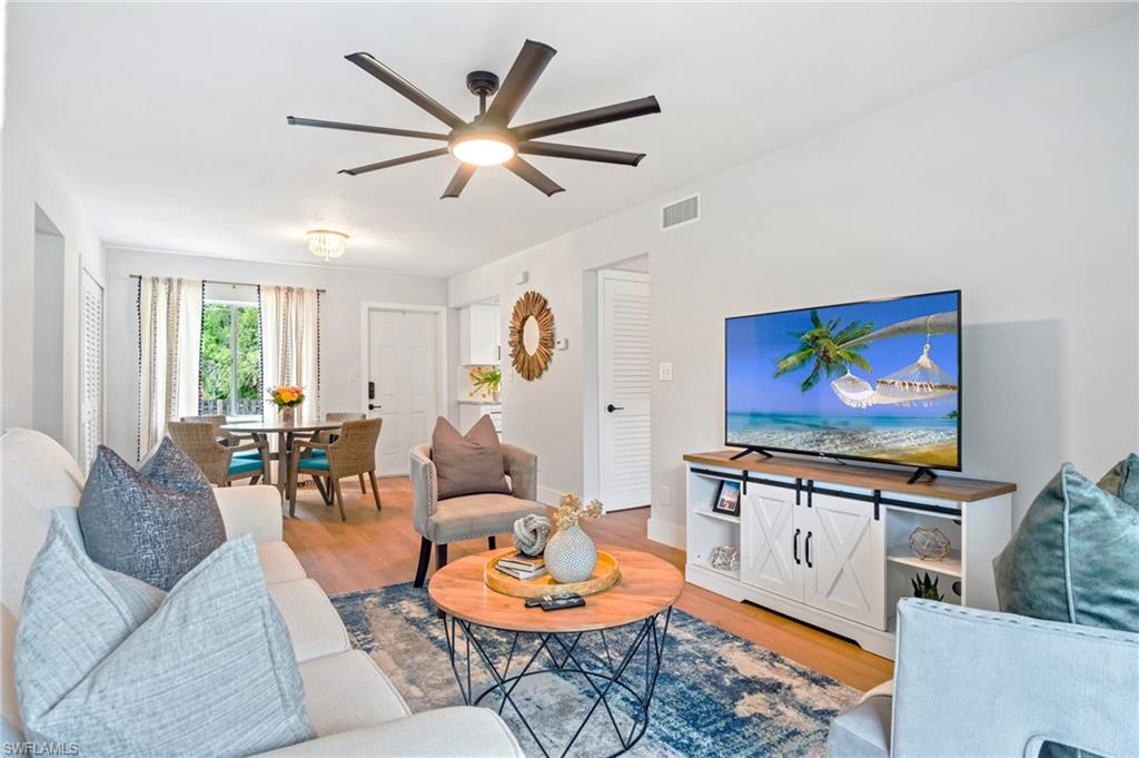 Living room featuring wood finished floors and ceiling fan