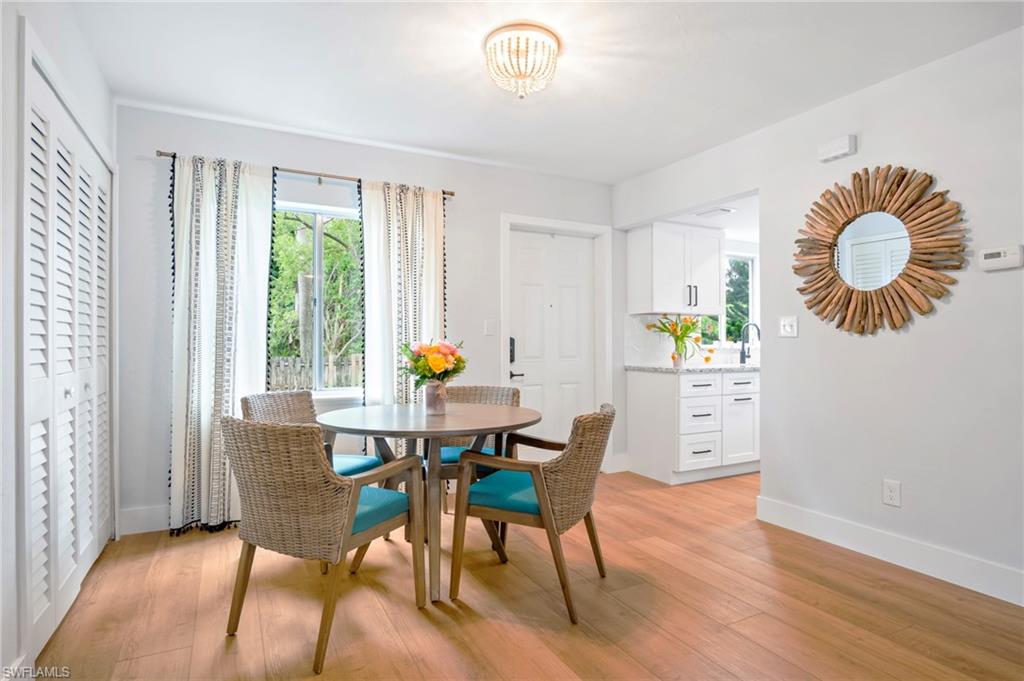 Dining area featuring baseboards and light wood-style floors