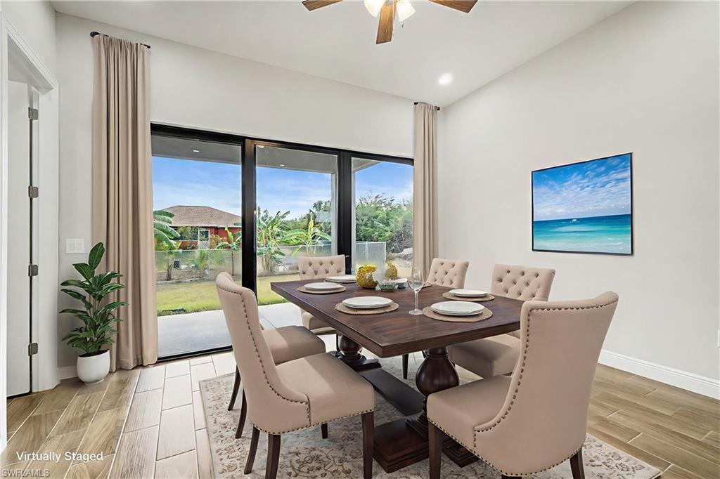 Dining space featuring wood finish floors and a ceiling fan