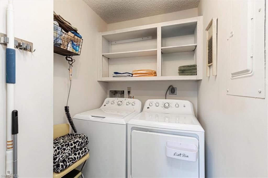 Laundry area with washing machine and clothes dryer