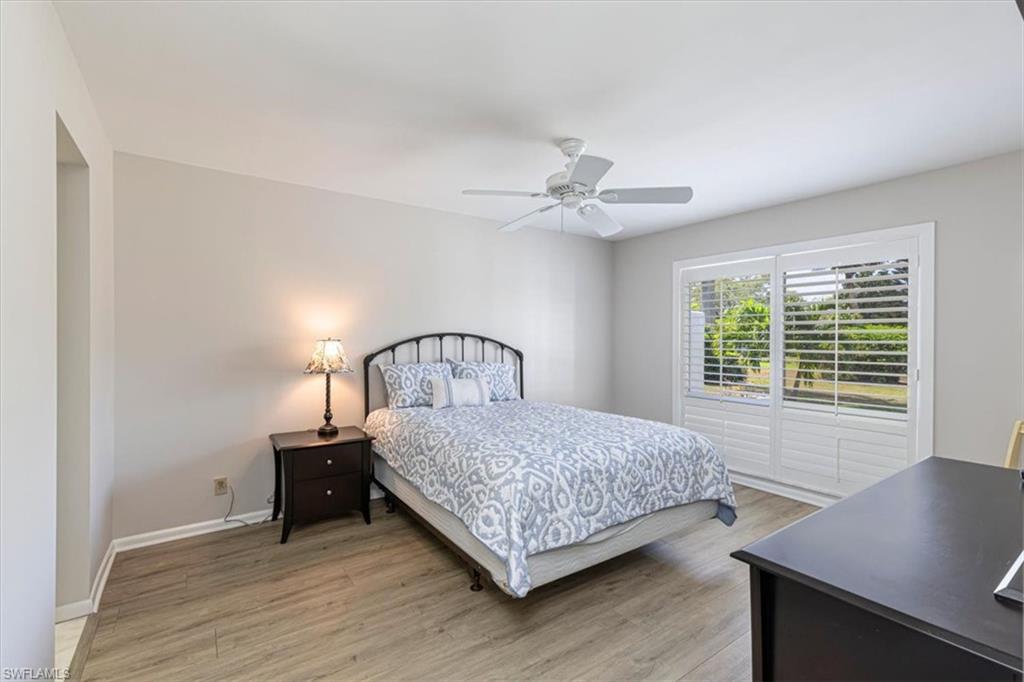 Primary Bedroom featuring light wood-style floors and a ceiling fan