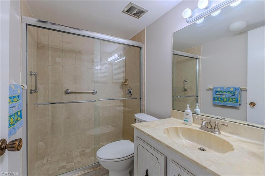 Guest Bathroom with vanity and a shower stall
