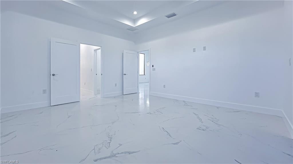 Unfurnished room featuring baseboards