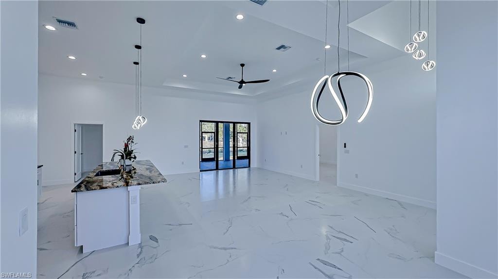 Unfurnished living room with recessed lighting and ceiling fan