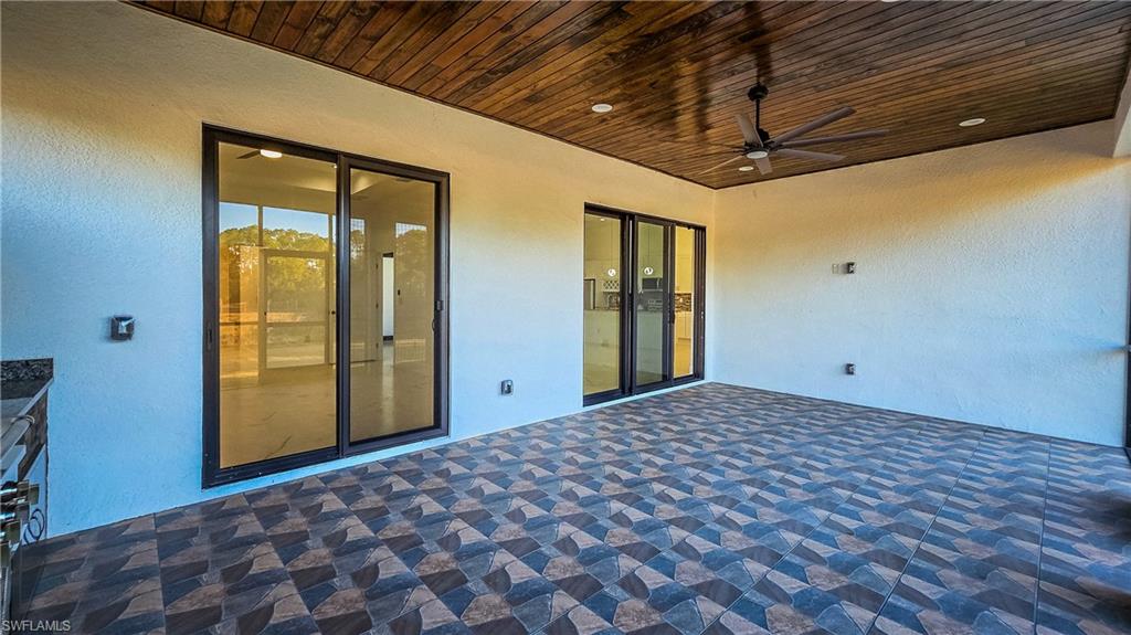 View of patio featuring a ceiling fan