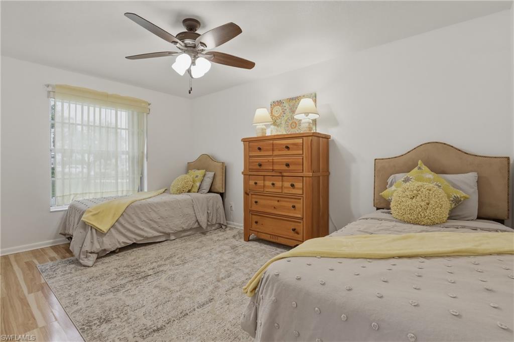 Bedroom#2 with a ceiling fan and wood finished floors