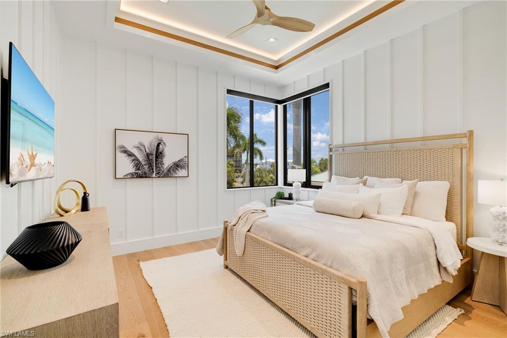 Bedroom flooded with natural light and custom wall trim