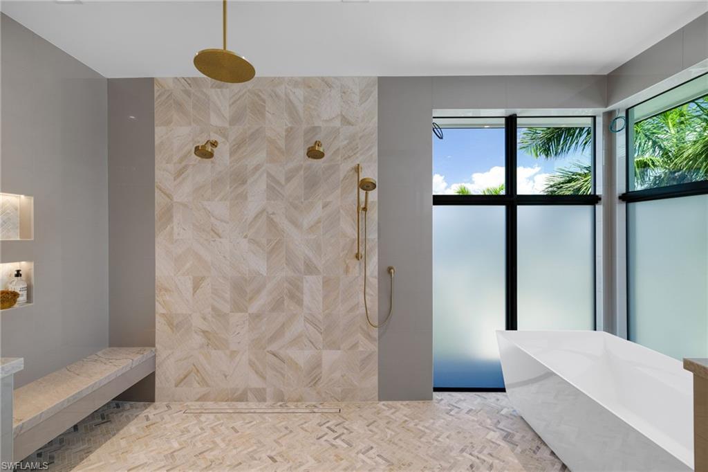 oversized shower with multiple fixtures