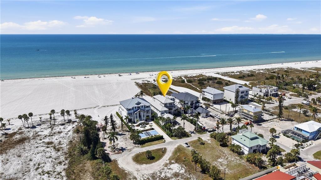 Aerial perspective of suburban area featuring expansive coastline - Virtually Edited Image