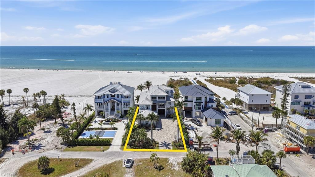 Aerial overview of property's location featuring extended coastline and property parcel outlined - Virtually Edited Image