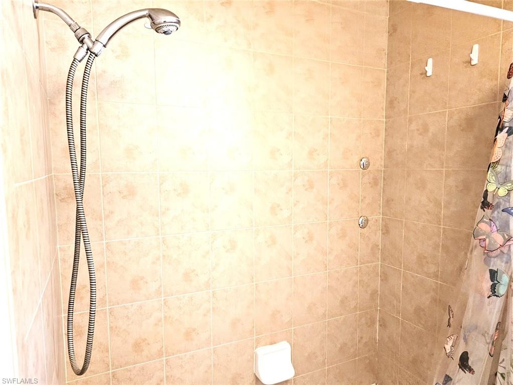 Full bathroom with tiled shower