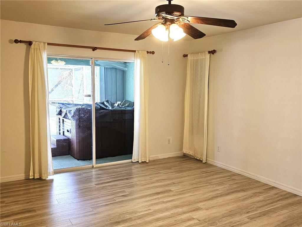 Spare room featuring ceiling fan and wood finished floors