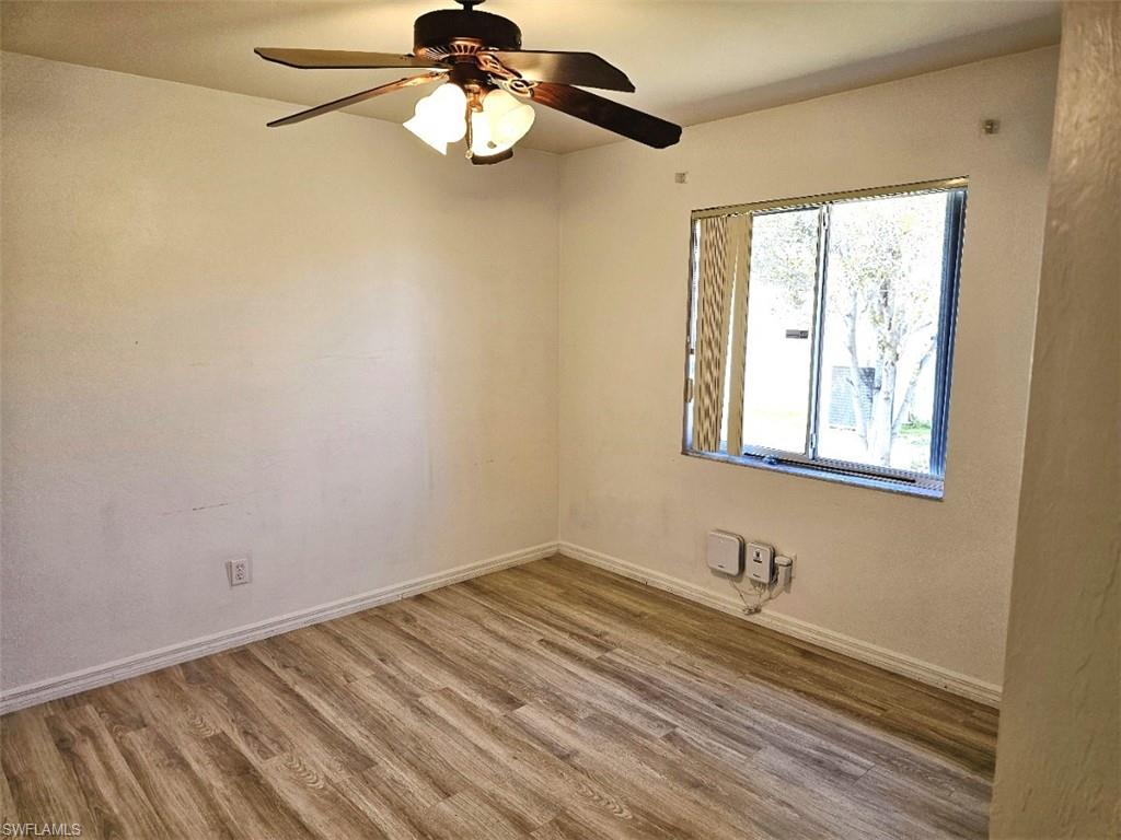 Spare room featuring light wood finished floors and a ceiling fan