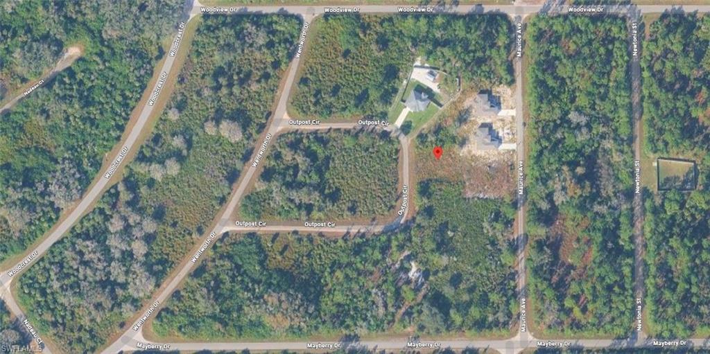 Aerial map of property and surrounding area featuring property parcel outlined