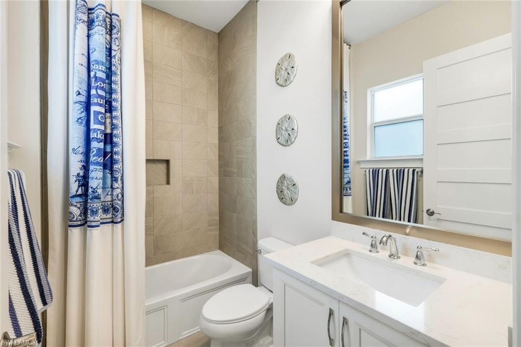 Full bathroom with vanity and shower / bath combo