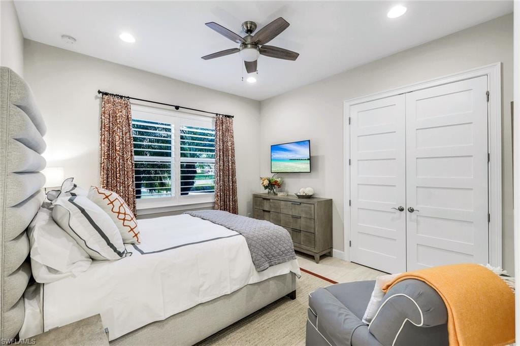 Bedroom featuring a closet, a ceiling fan, and recessed lighting