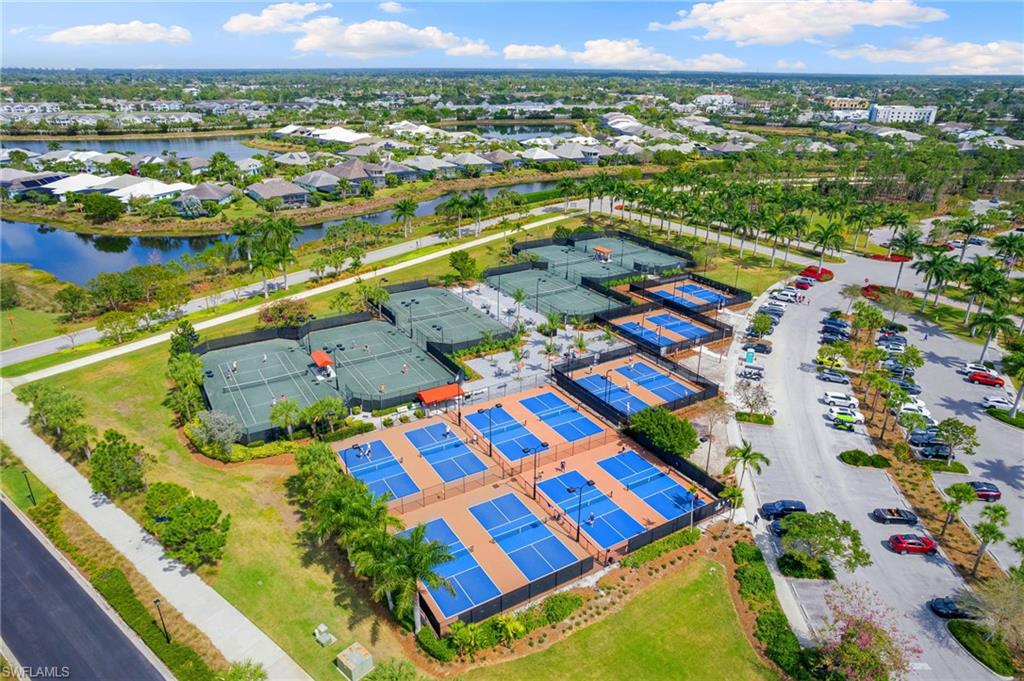 Aerial perspective of suburban area featuring a large body of water
