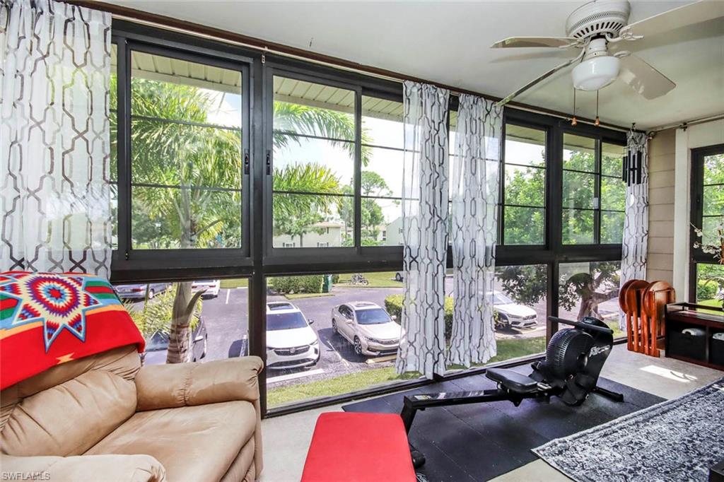 Sunroom / solarium with ceiling fan and plenty of natural light