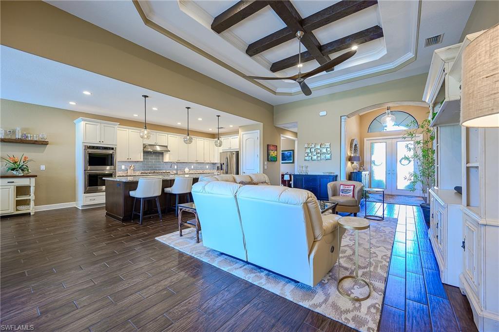 tray ceiling with crown molding and custom beams