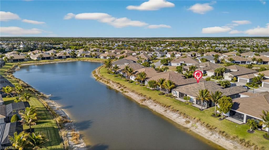 Aerial perspective of suburban area with a large body of water