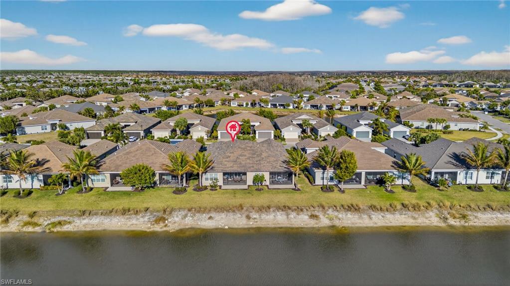 Aerial view featuring a nearby body of water
