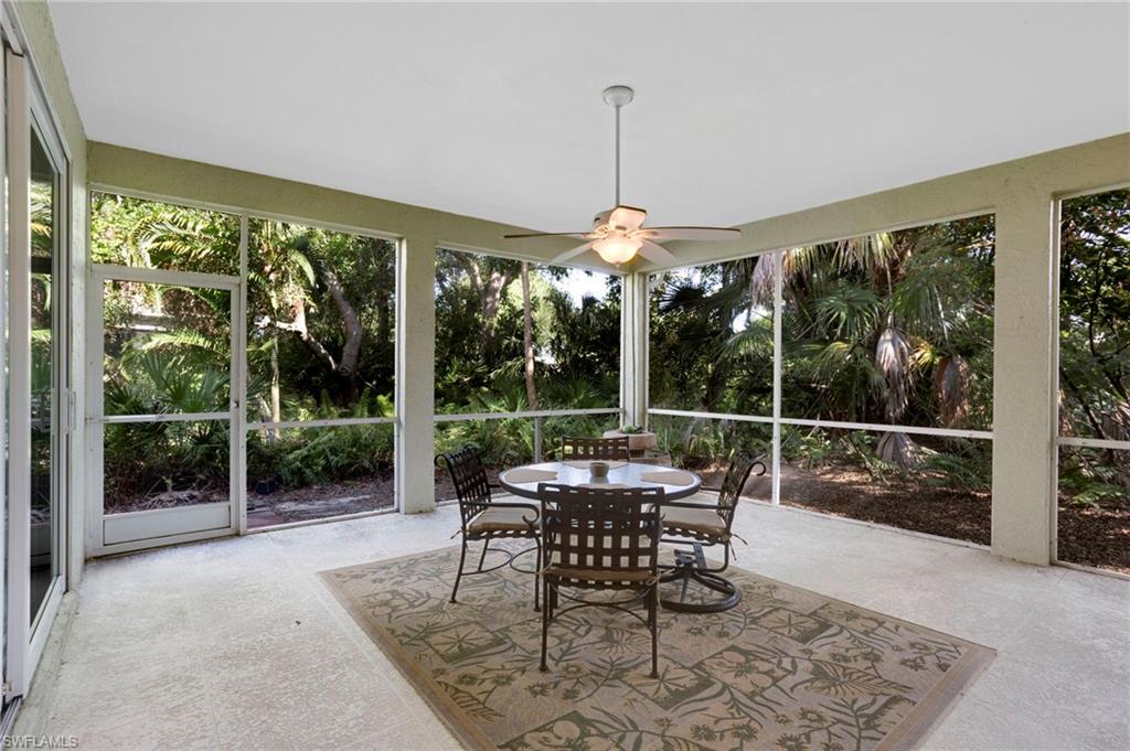 Oversized lanai surrounded by lush tropical landscaping