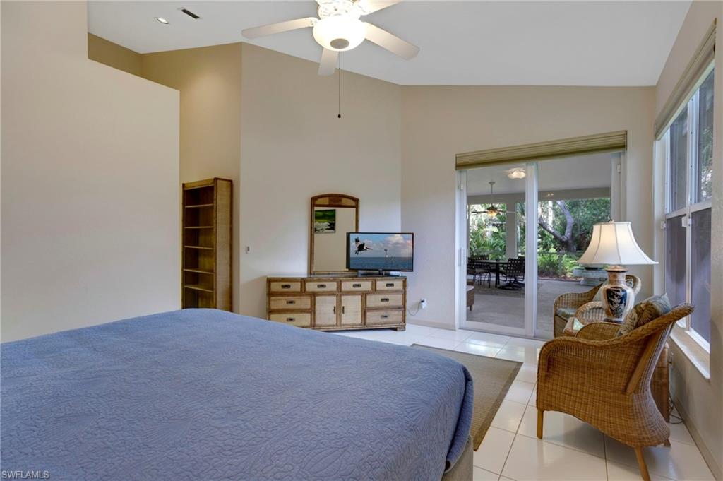Extra-large master bedroom has vaulted ceilings and fits a king-size bed and then some! Impact sliders lead to lanai.