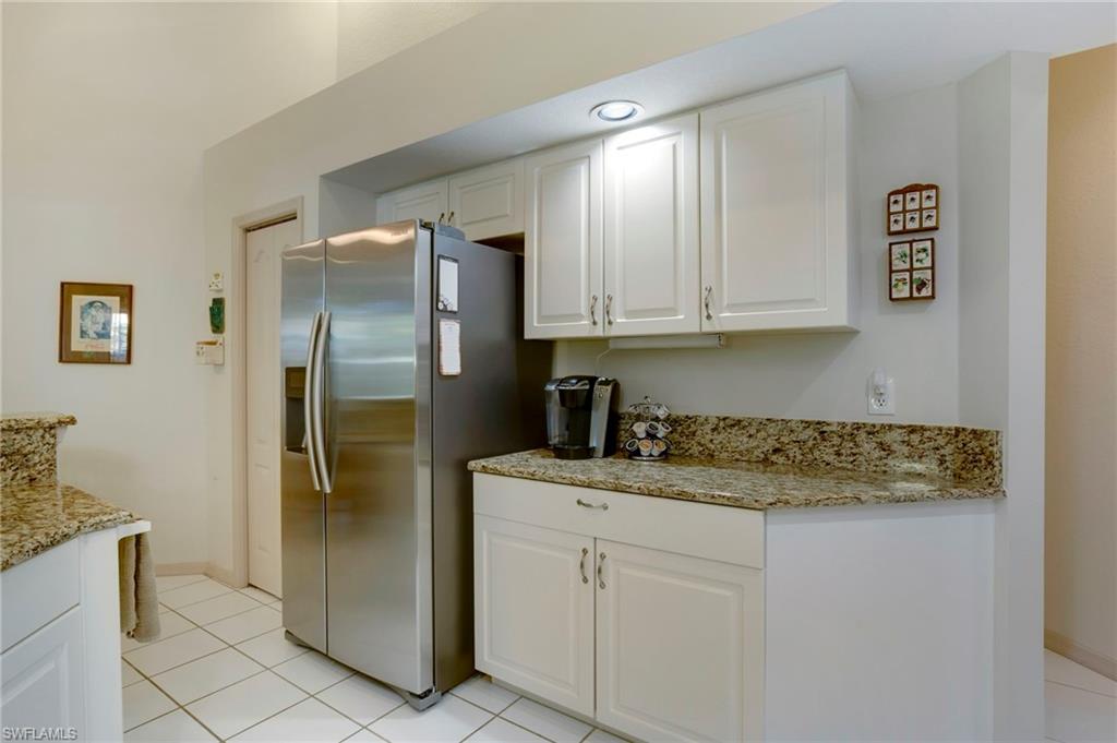 Kitchen features granite countertops and stainless steel appliances