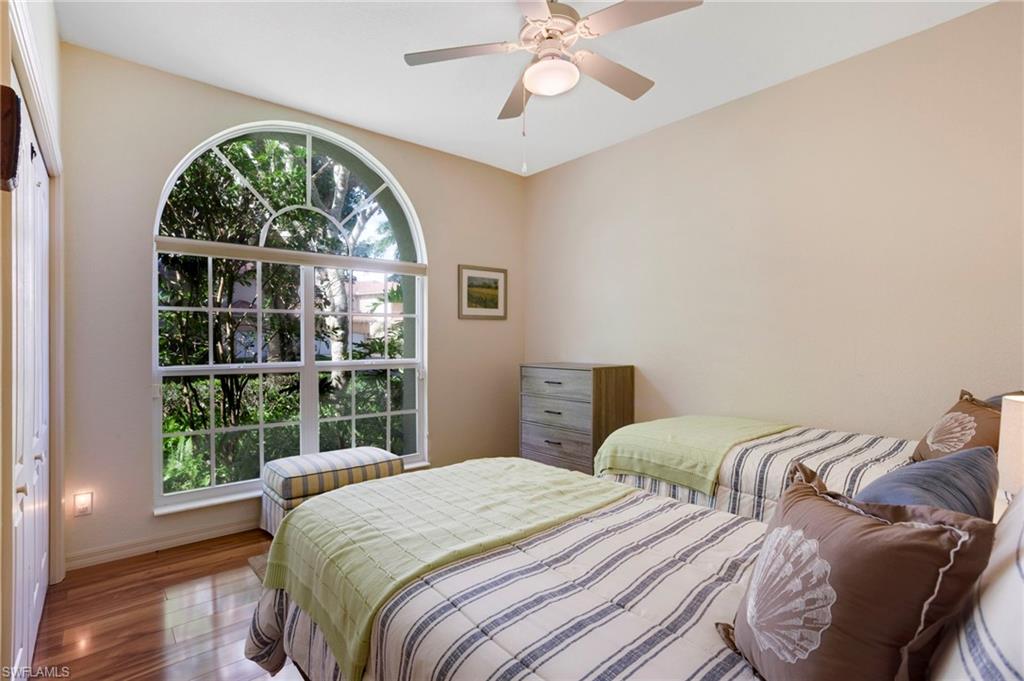 Guest bedroom is large and bright.