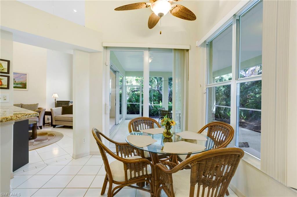 Breakfast nook in kitchen, with impact sliders to lanai