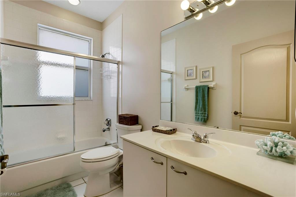 Full bath between guest bedroom and den.