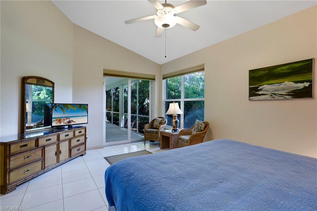 Extra-large master bedroom has vaulted ceilings and fits a king-size bed and then some! Impact sliders lead to lanai.